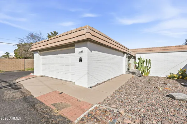 a bedroom with a bed and a mirror