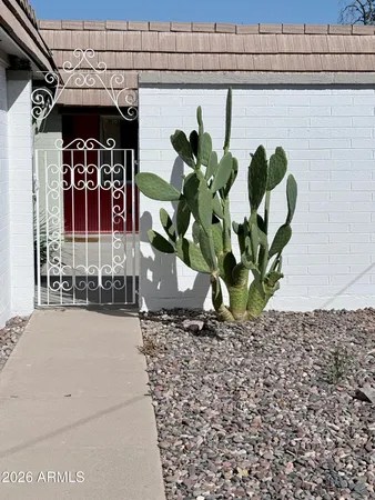 a view of a swimming pool with a yard in front of it