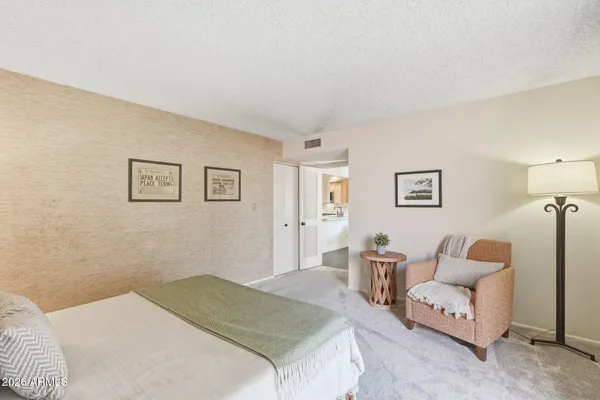 a bedroom with a bed and furniture