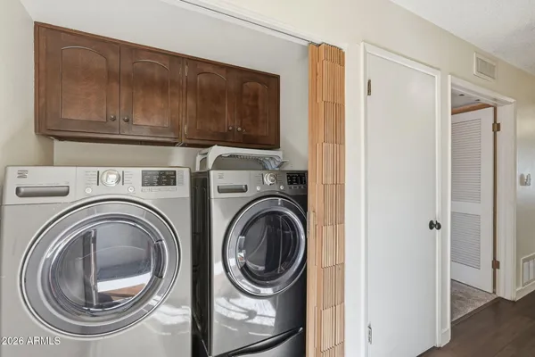 a utility room with dryer and washer