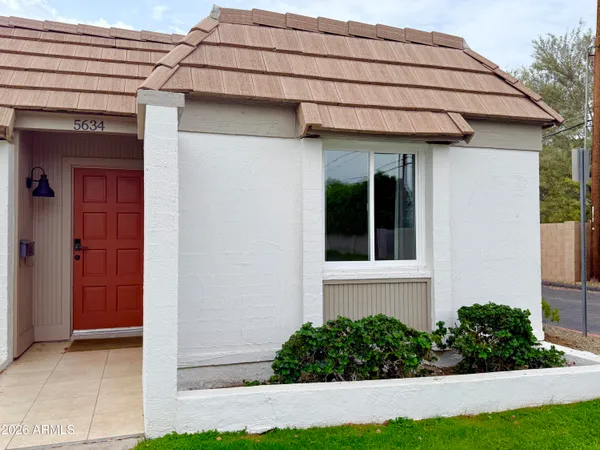 a picture of a bench in front of a wall