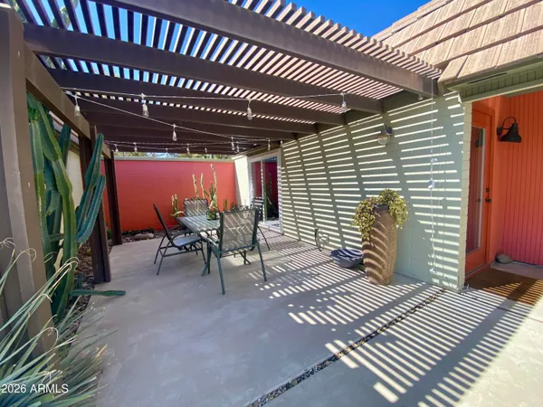 a front view of a house with lounge chair