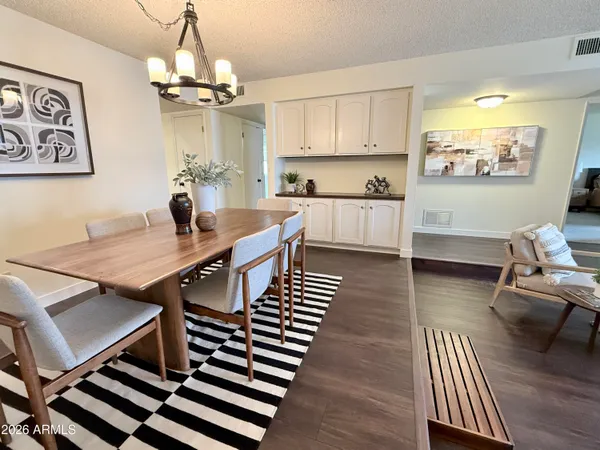 a view of a dining room with furniture window and wooden floor