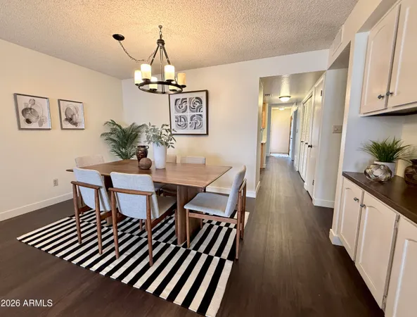 a kitchen with stainless steel appliances white cabinets white stove a refrigerator and a microwave