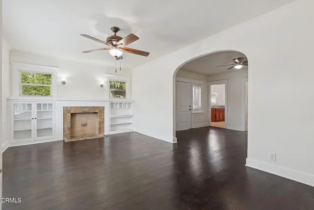 an entryway with a window and a livingroom