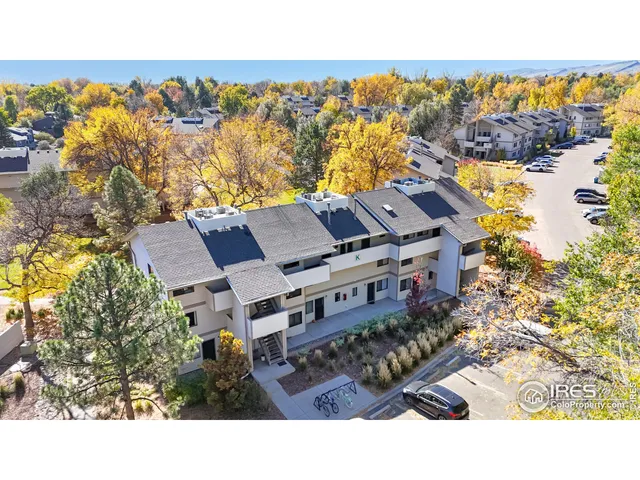 a view of houses with an outdoor space and seating