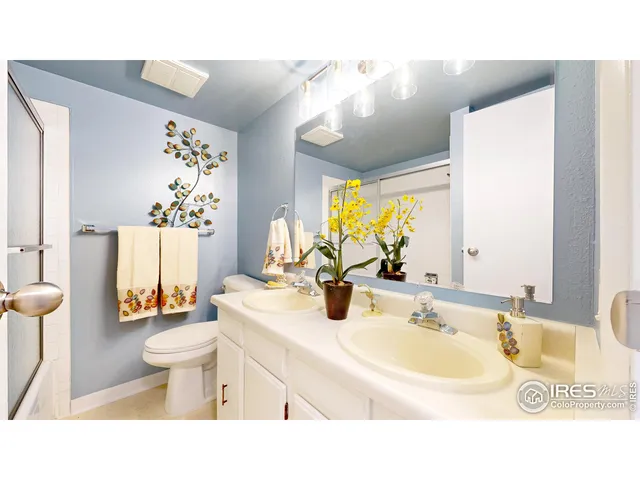 a bathroom with a sink toilet mirror and shower