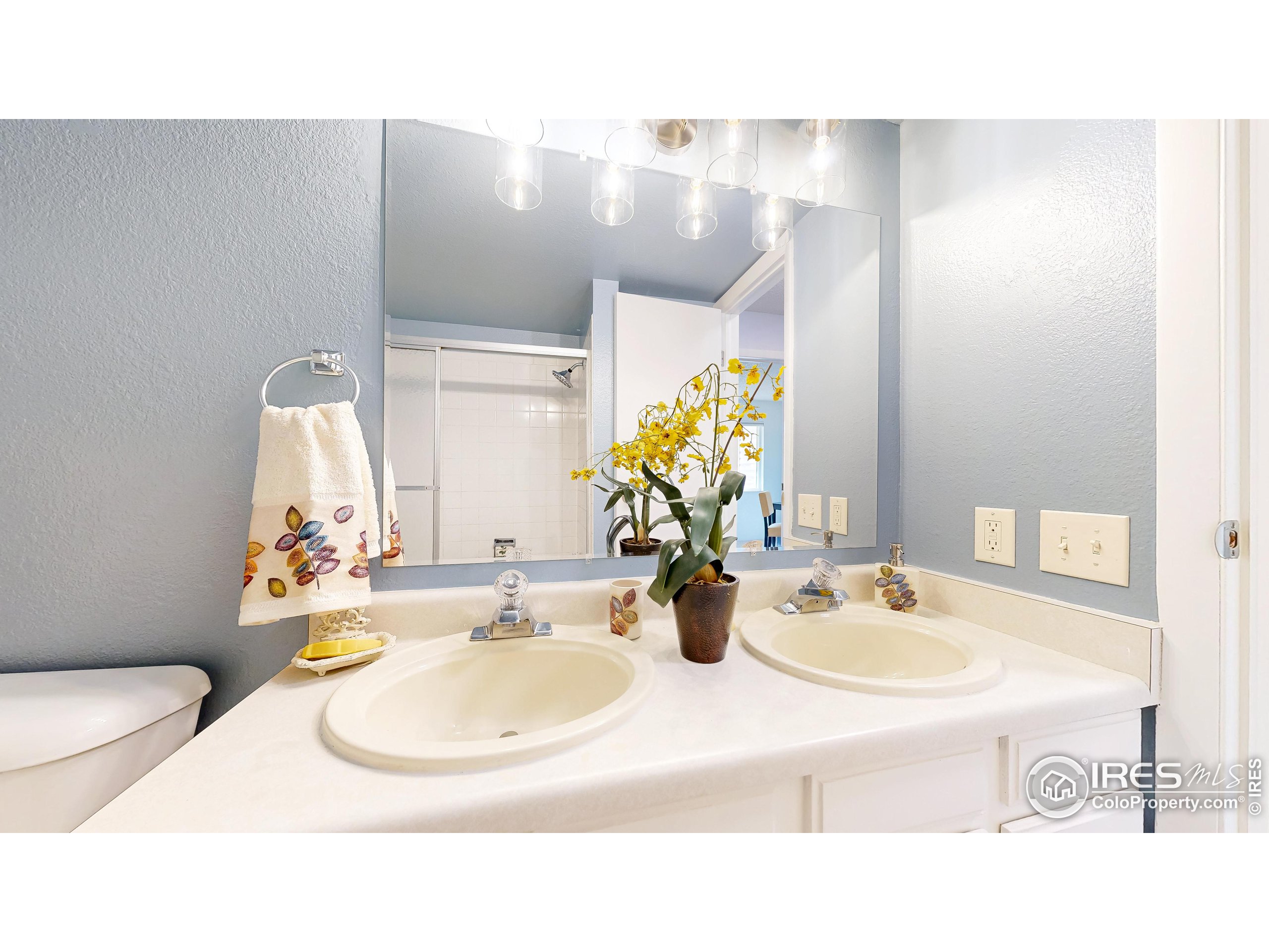 1705 Heatheridge Road, Unit K105 Fort Collins, CO 80526 - Photo 15 of 30 a bathroom with a sink mirror and vanity