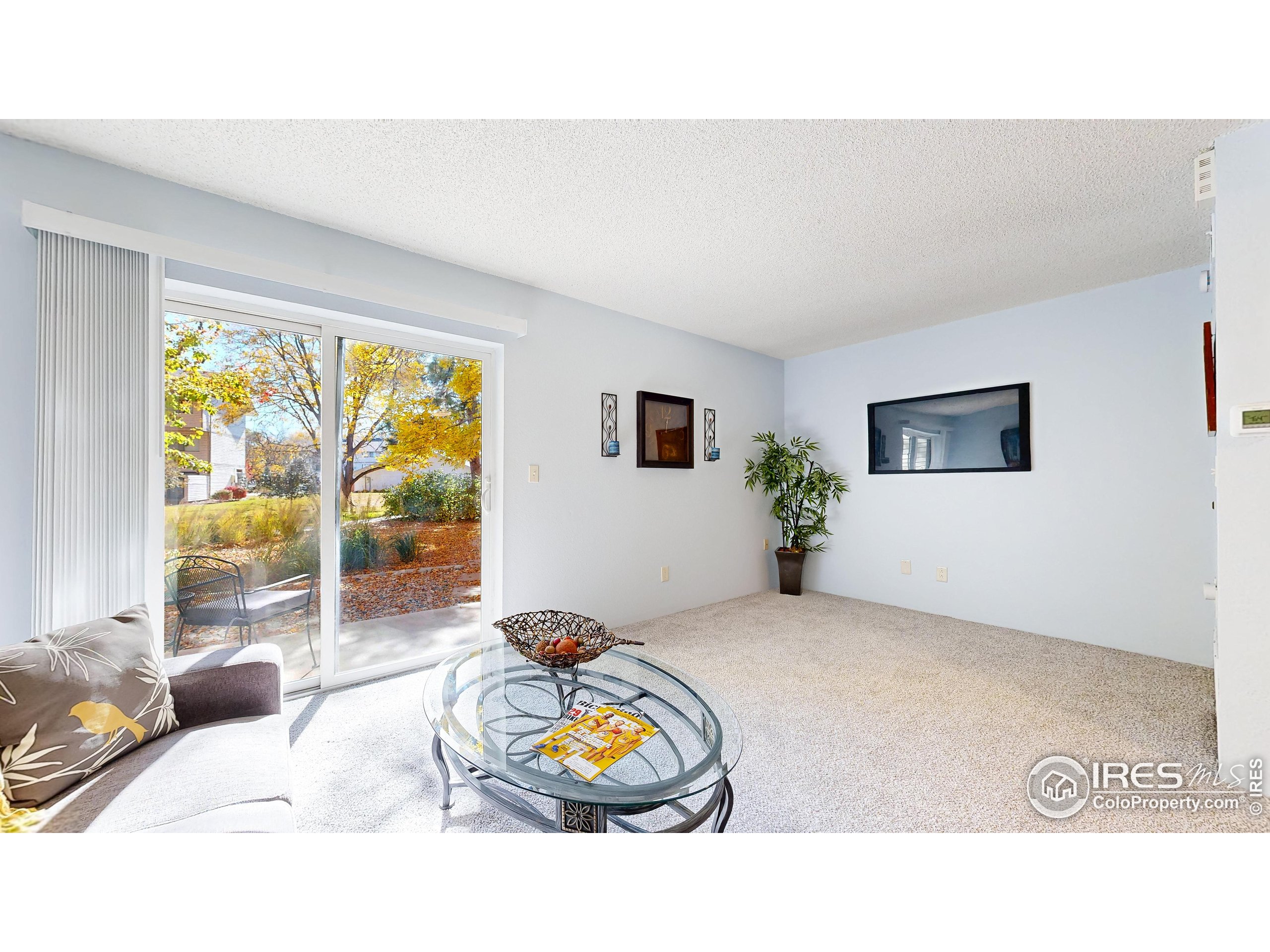 1705 Heatheridge Road, Unit K105 Fort Collins, CO 80526 - Photo 6 of 30 a living room with furniture and a flat screen tv