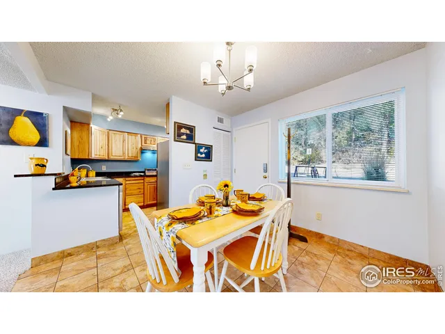 a kitchen with a table and chairs