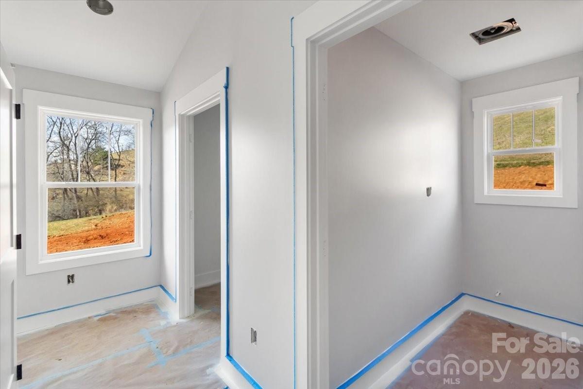 94 Baileys Cove Road, Unit 9 Marshall, NC 28753 - Photo 18 of 30 a view of an empty room with window and wooden floor