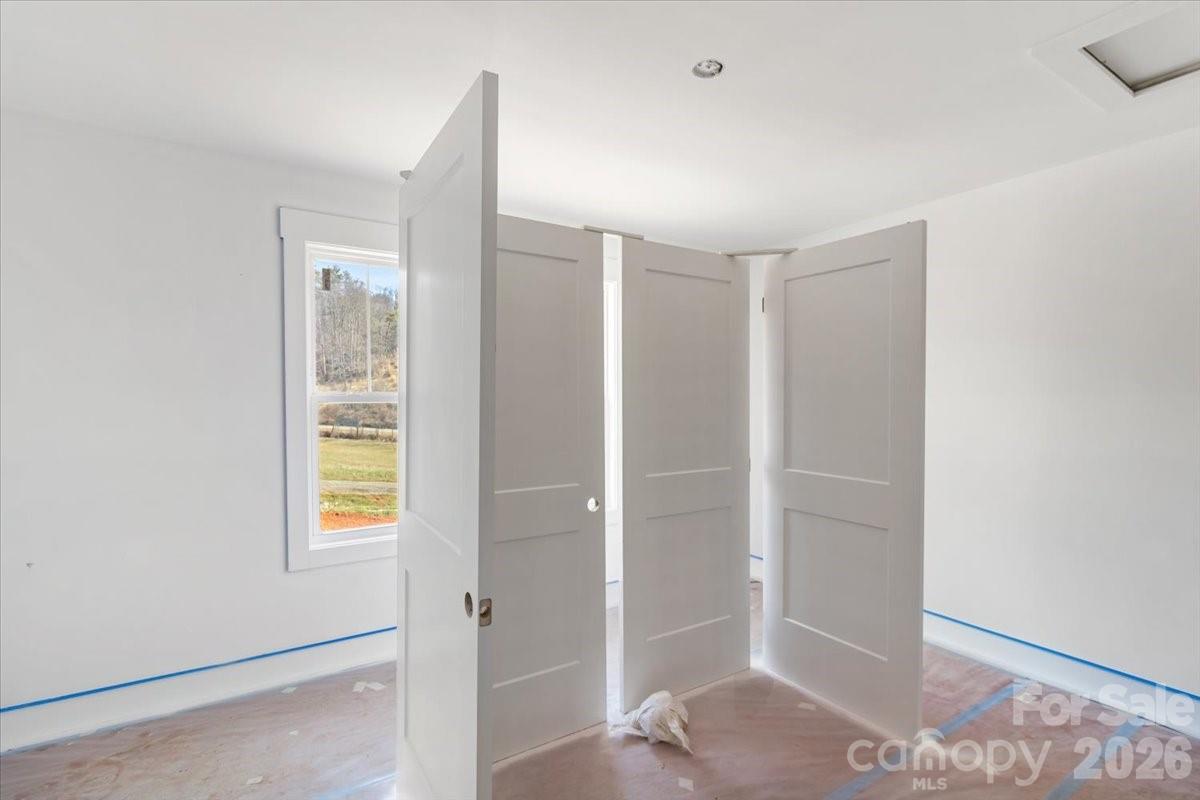 94 Baileys Cove Road, Unit 9 Marshall, NC 28753 - Photo 27 of 30 an empty room with windows