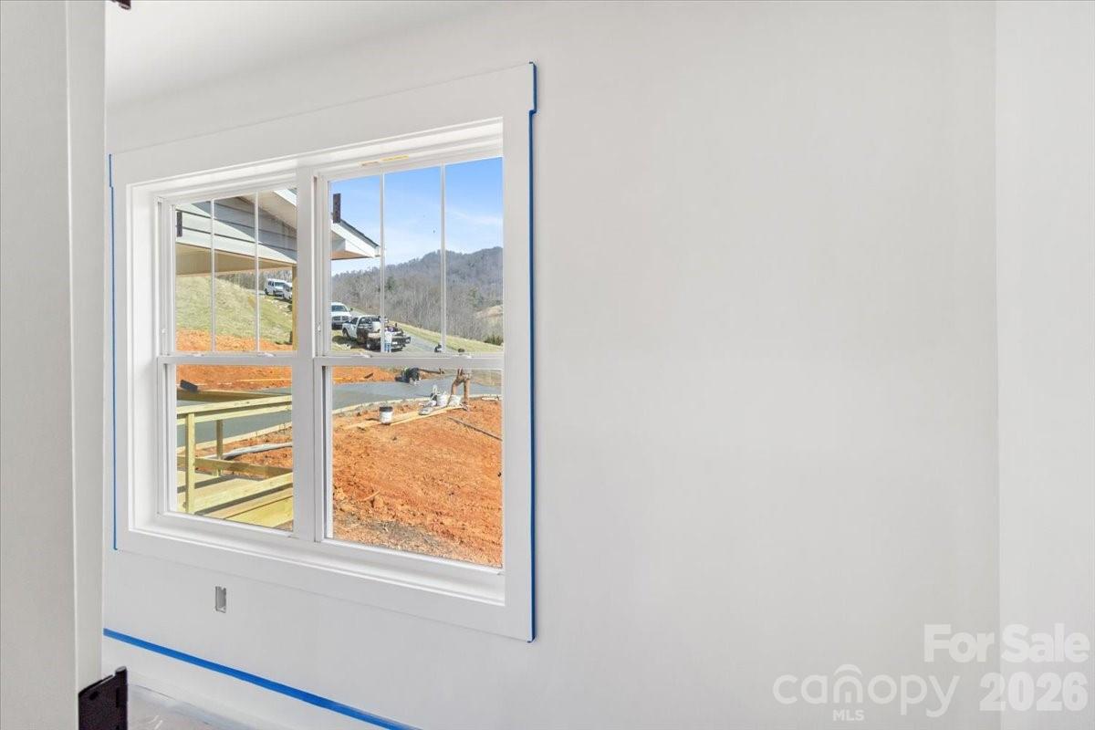 94 Baileys Cove Road, Unit 9 Marshall, NC 28753 - Photo 28 of 30 a view of a room that has a window in it