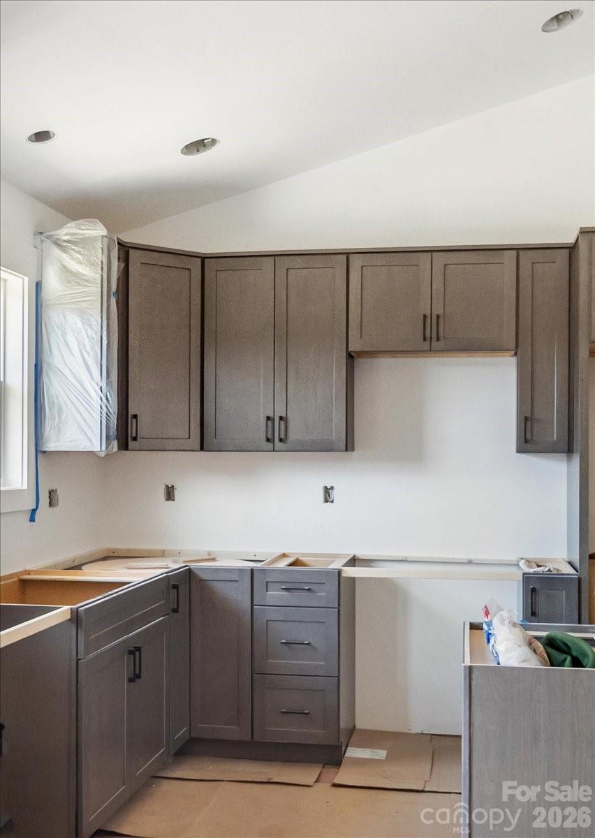 94 Baileys Cove Road, Unit 9 Marshall, NC 28753 - Photo 10 of 30 a kitchen with cabinets and window