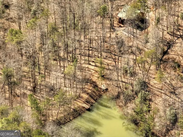 a view of a lake with a yard and mountain view
