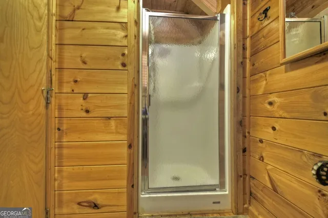 a living room with furniture a flat screen tv and a toilet