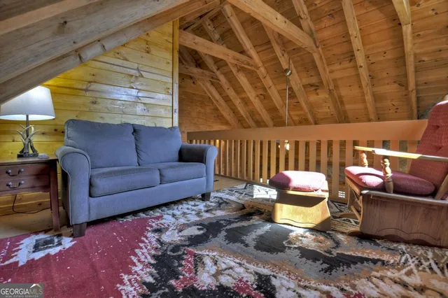 a bedroom with a bed a flat screen tv and a walk in closet