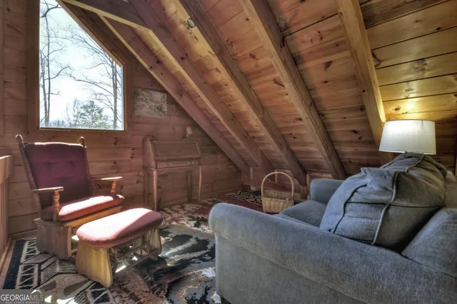 a bedroom with furniture and a chandelier