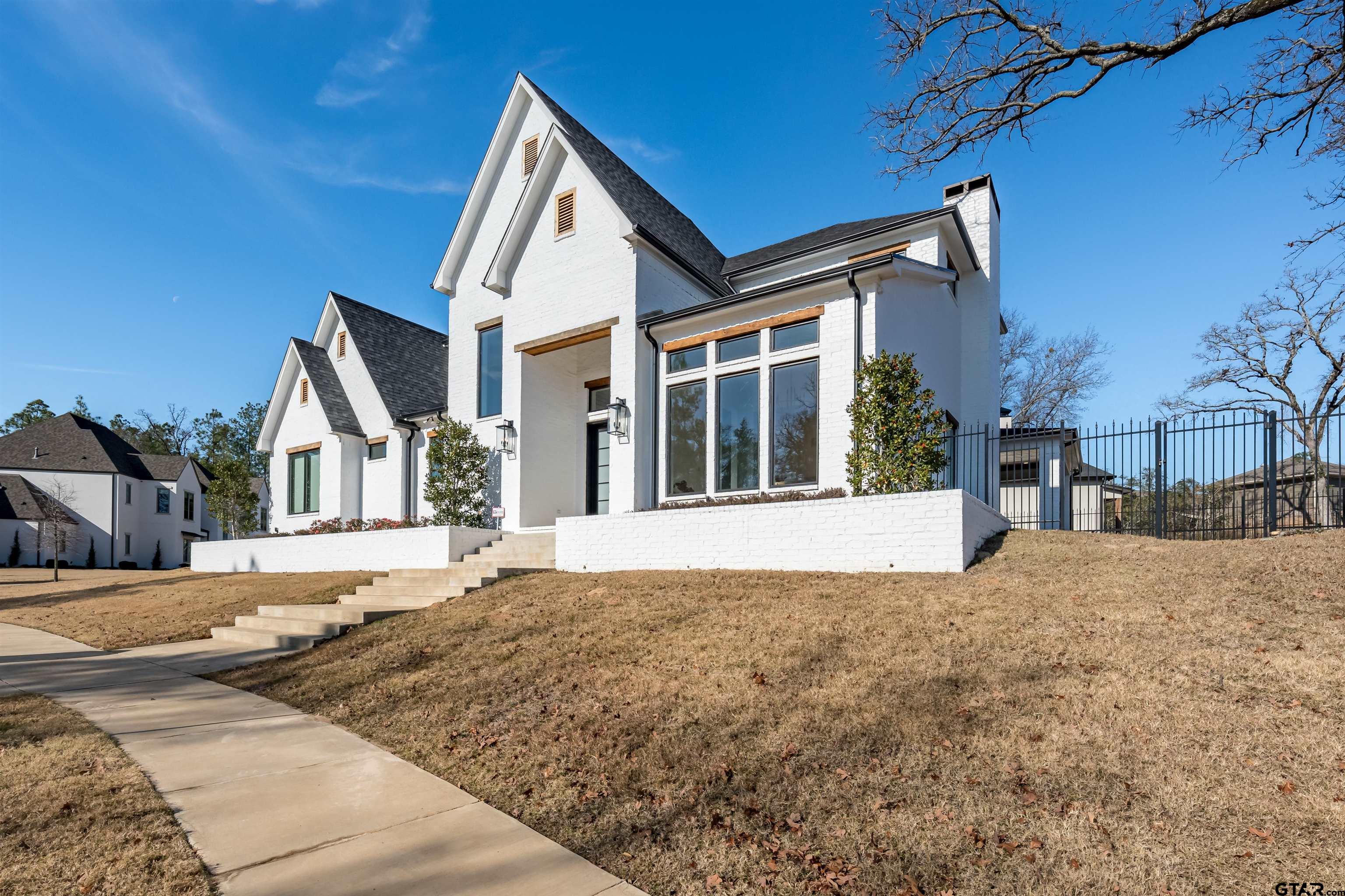 a view of house with yard