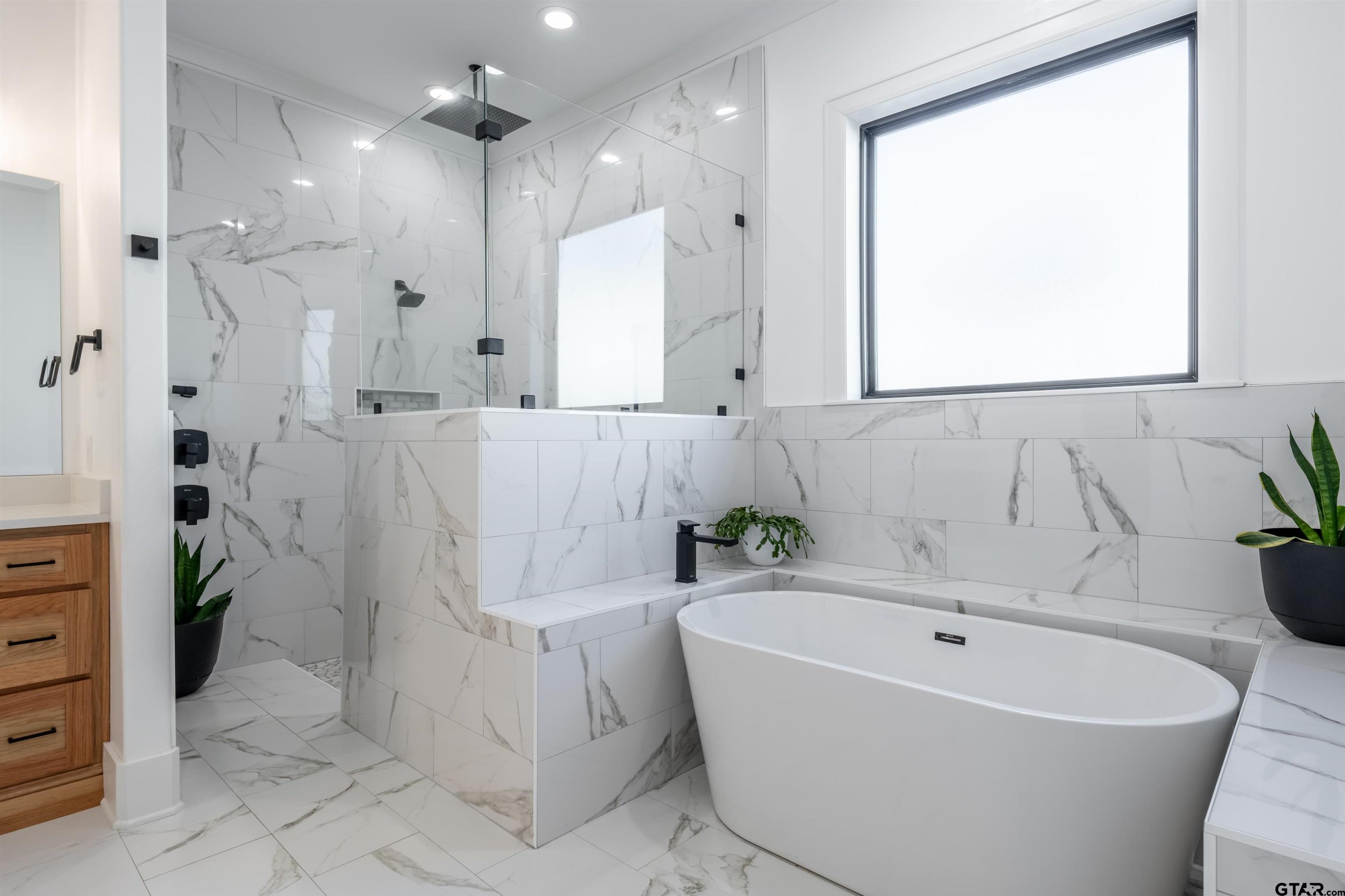 3005 Forest Trail Tyler, TX 75703 - Photo 12 of 32 a bathroom with a bathtub and shower