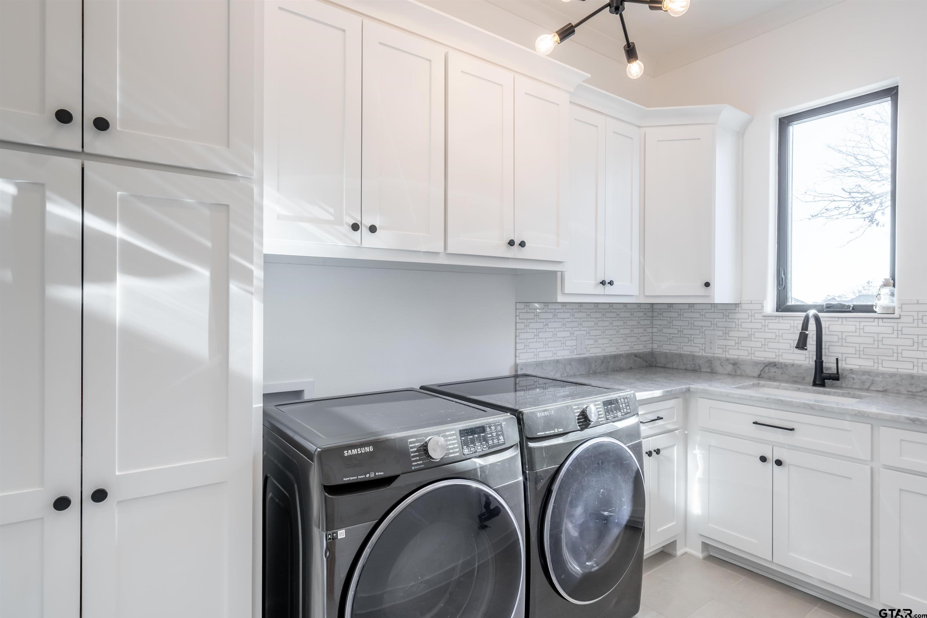 3005 Forest Trail Tyler, TX 75703 - Photo 16 of 32 a view of a kitchen with sink washer and dryer