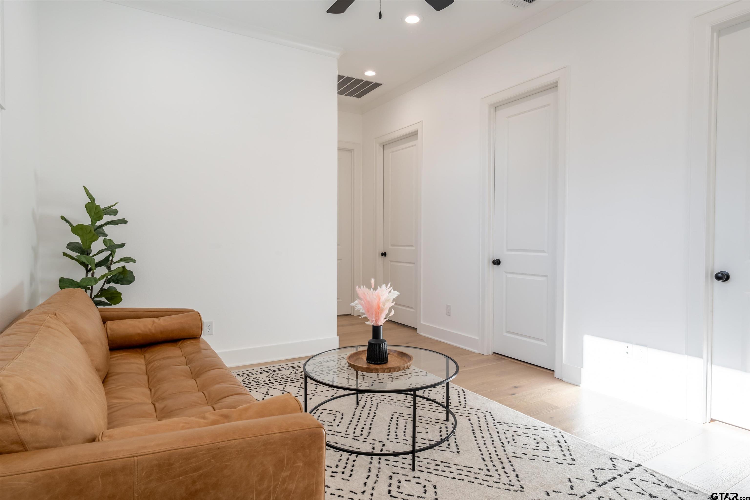 3005 Forest Trail Tyler, TX 75703 - Photo 21 of 32 a living room with furniture and a potted plant