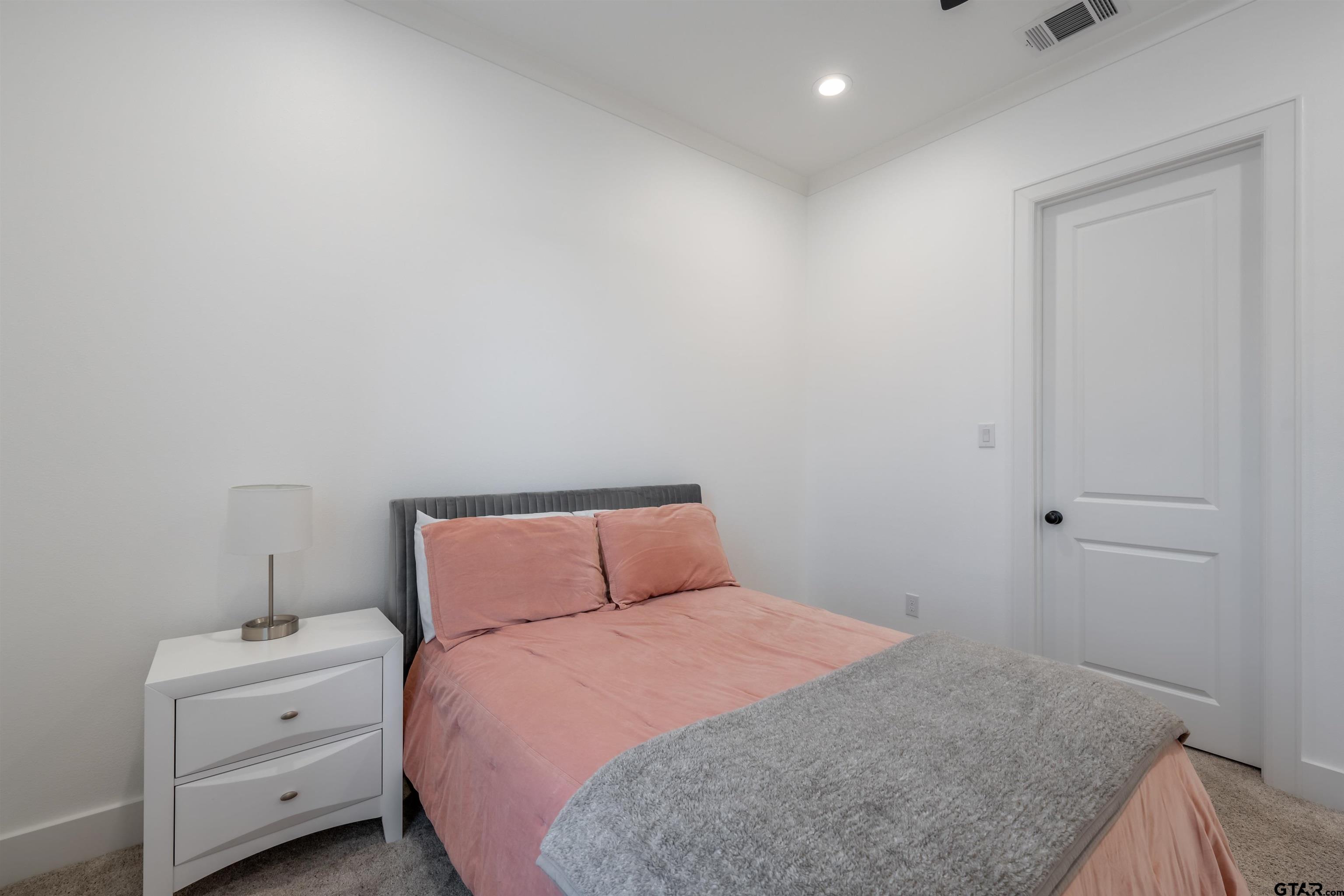 3005 Forest Trail Tyler, TX 75703 - Photo 24 of 32 a bedroom with a bed and a closet