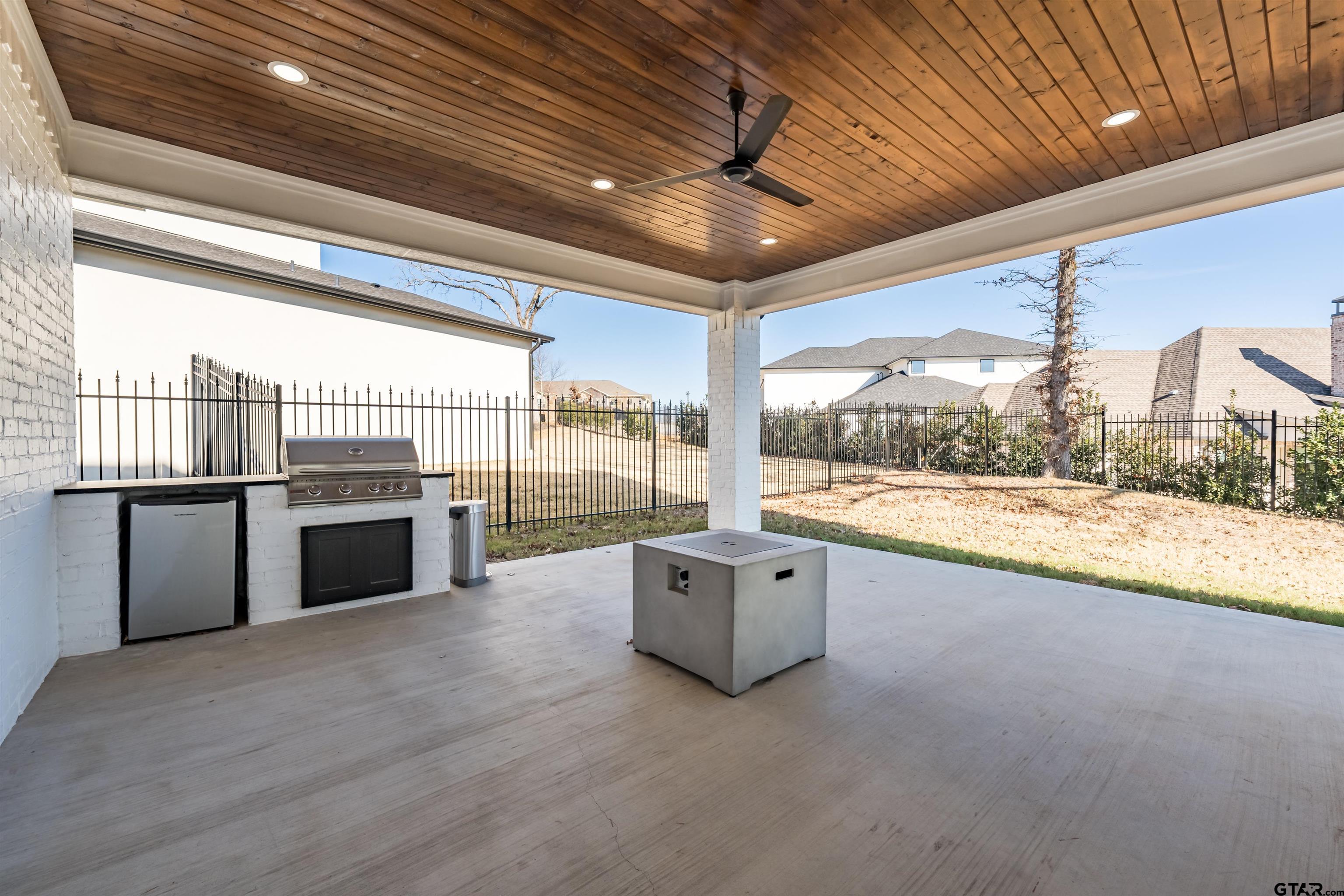 3005 Forest Trail Tyler, TX 75703 - Photo 29 of 32 a open hall with stainless steel appliances wooden floor and chandelier