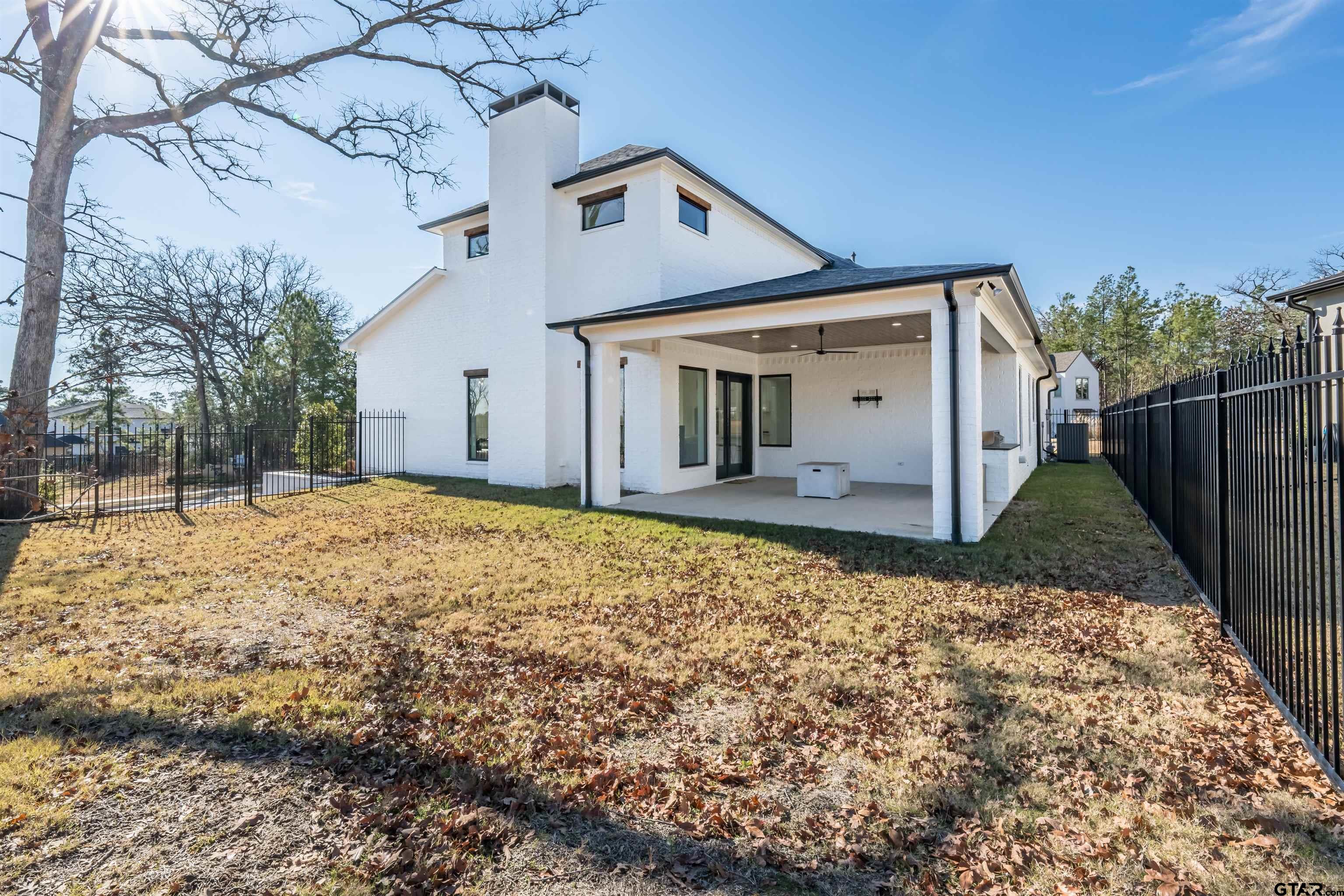 3005 Forest Trail Tyler, TX 75703 - Photo 30 of 32 a front view of a house with a yard