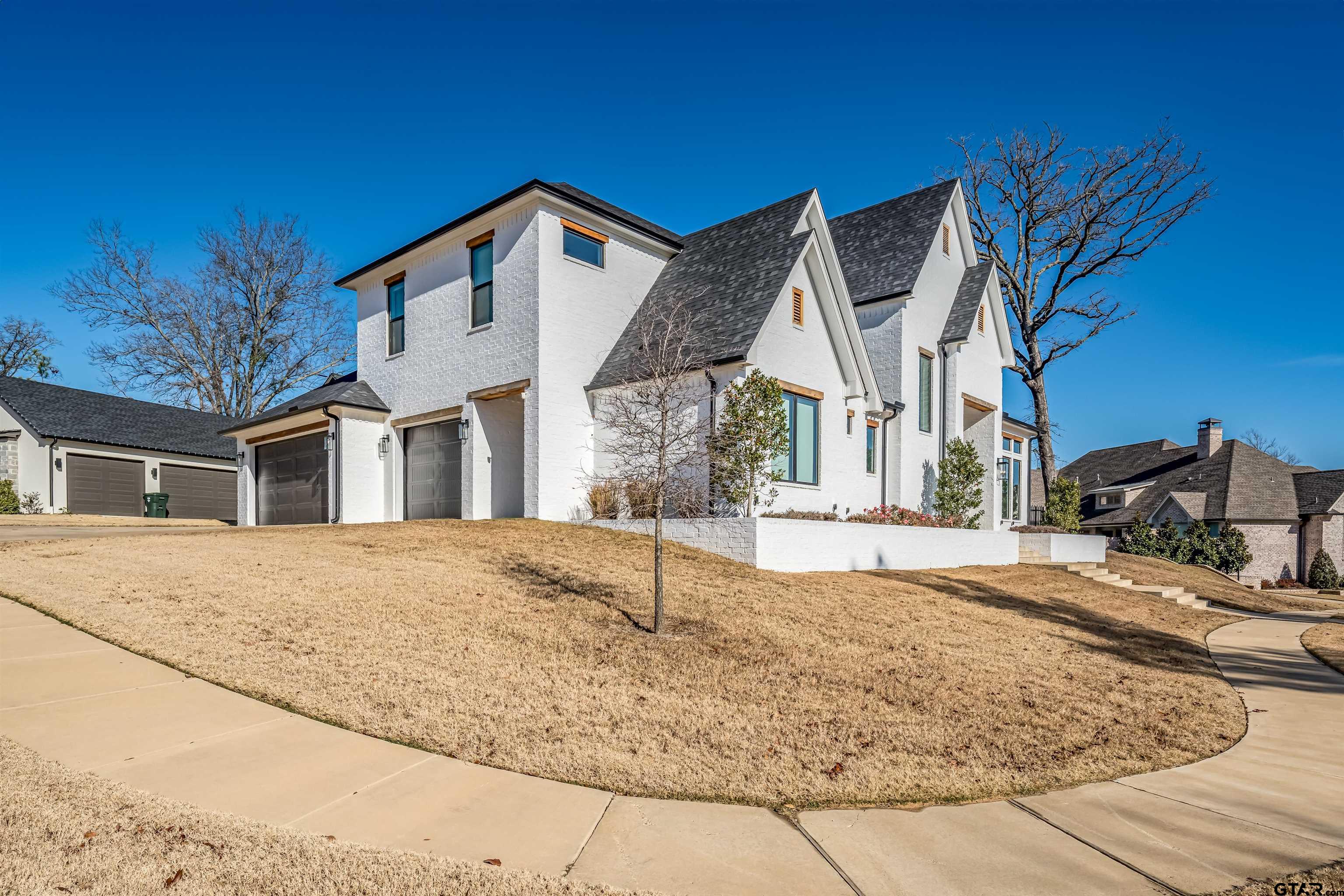 3005 Forest Trail Tyler, TX 75703 - Photo 31 of 32 a view of a house with snow on the road