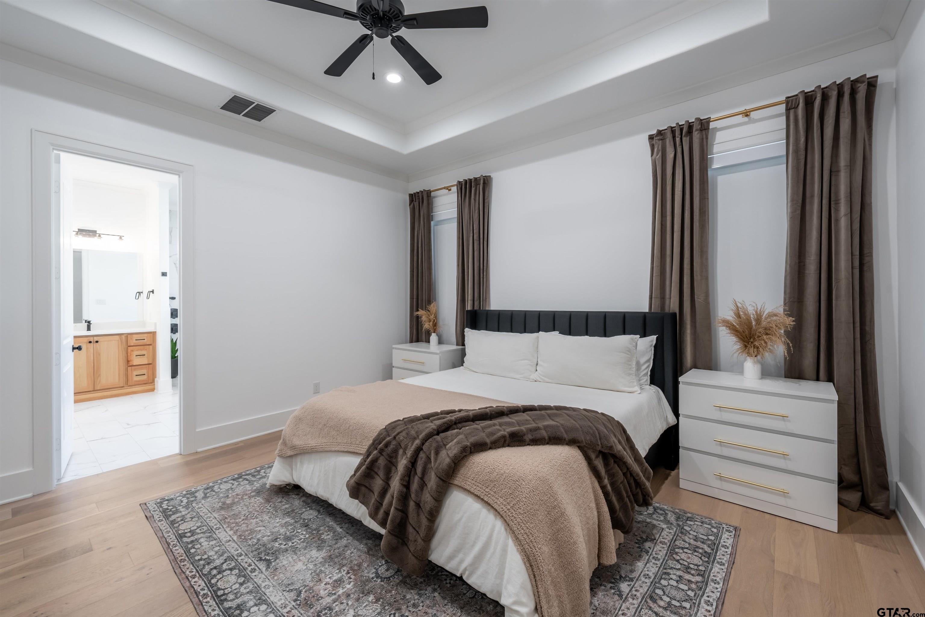 3005 Forest Trail Tyler, TX 75703 - Photo 10 of 32 a bedroom with a large bed and a window