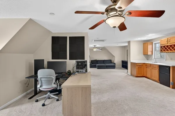 a workspace with a ceiling fan