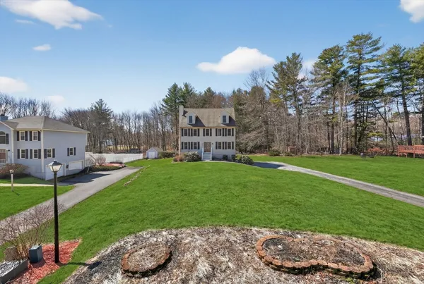 a view of a house with a backyard