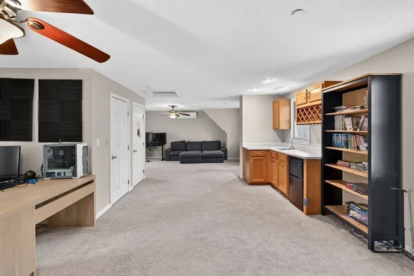 a room with furniture and white walls
