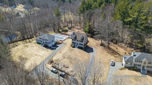 a picture of a room with a white wall and a large window