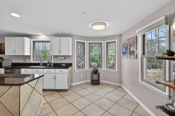 a kitchen with a stove a sink and a refrigerator
