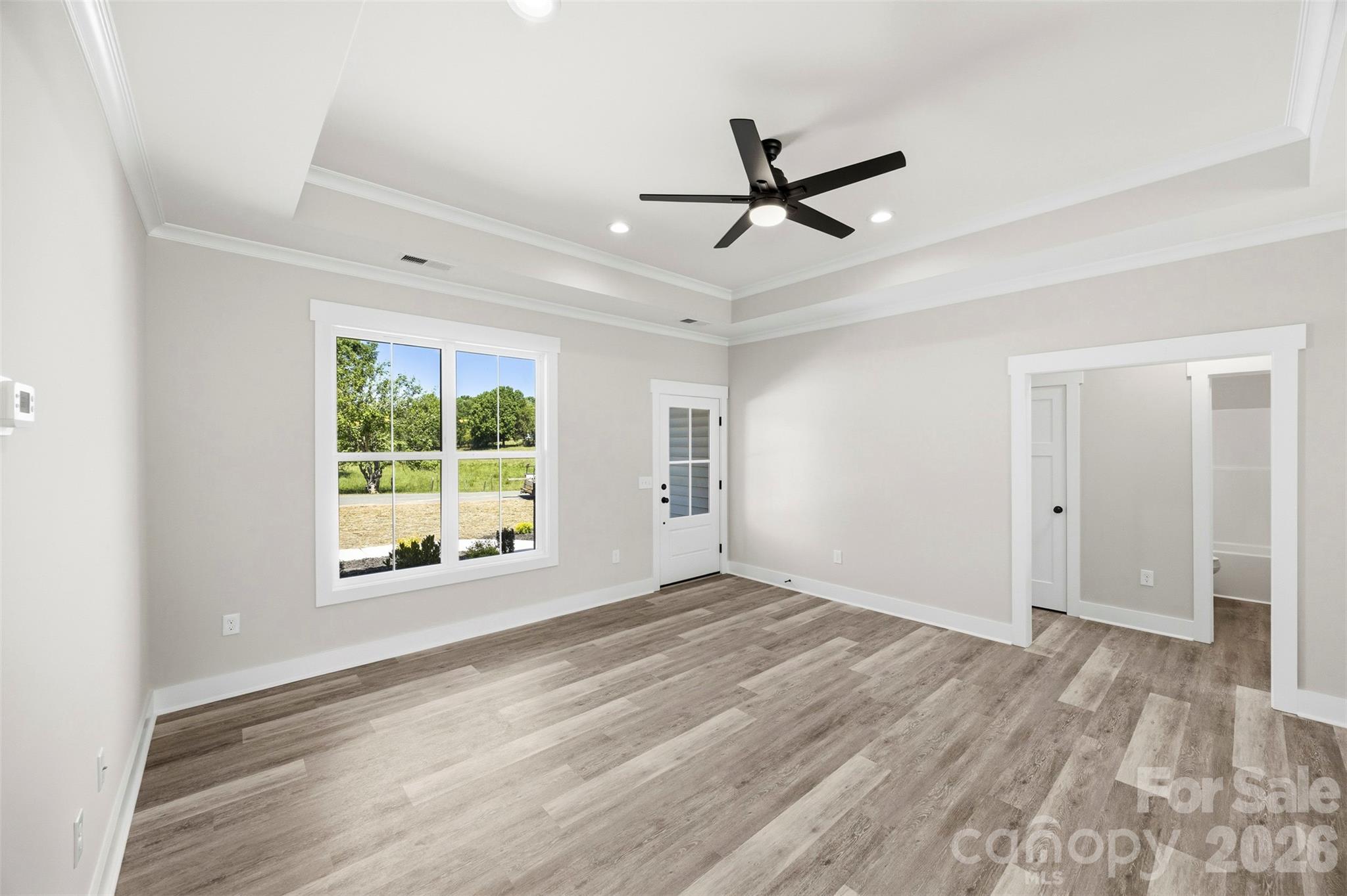 1014 Speight Road Albemarle, NC 28001 - Photo 6 of 28 a view of empty room with wooden floor and fan