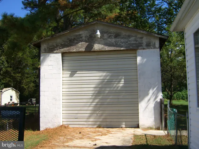 a view of a house that has a small yard