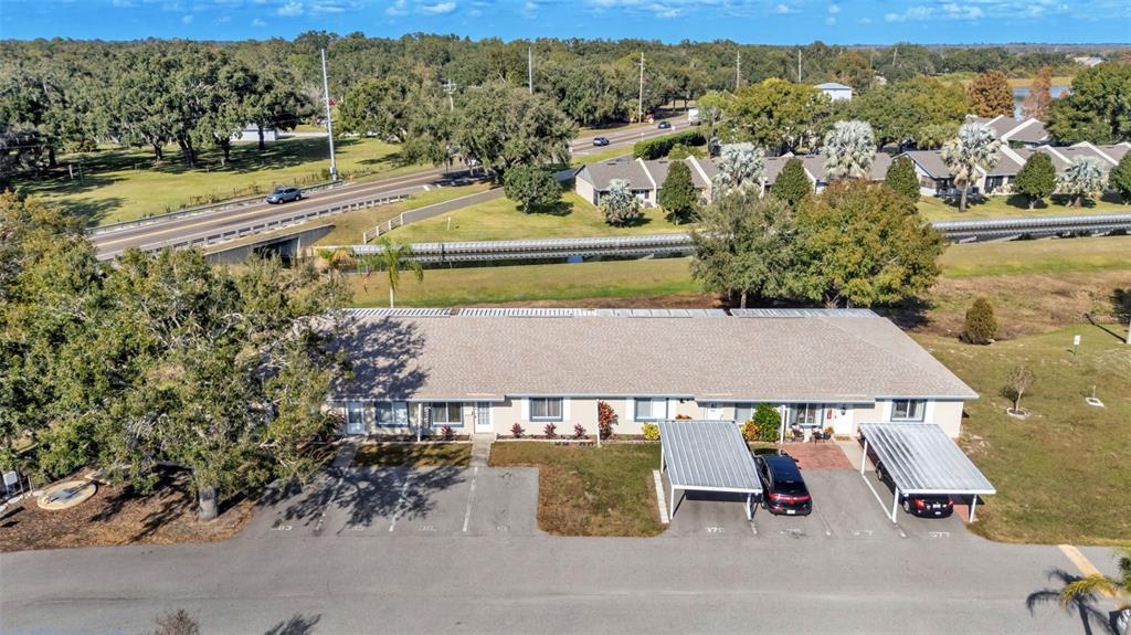 381 Winter Ridge Boulevard Winter Haven, FL 33881 - Photo 17 of 50 an aerial view of residential houses with outdoor space and river
