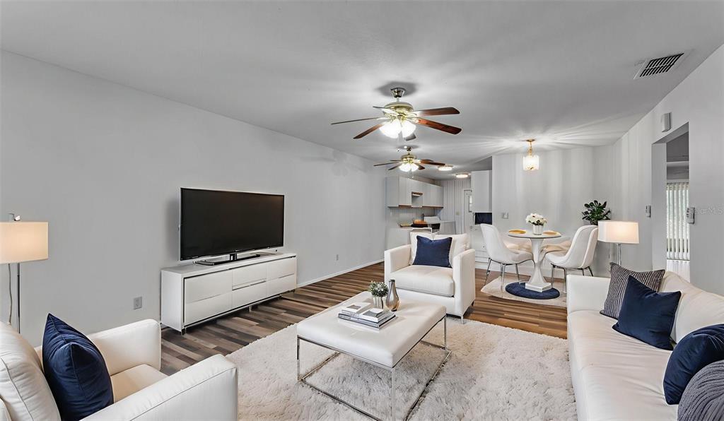 381 Winter Ridge Boulevard Winter Haven, FL 33881 - Photo 2 of 50 a living room with furniture and a flat screen tv