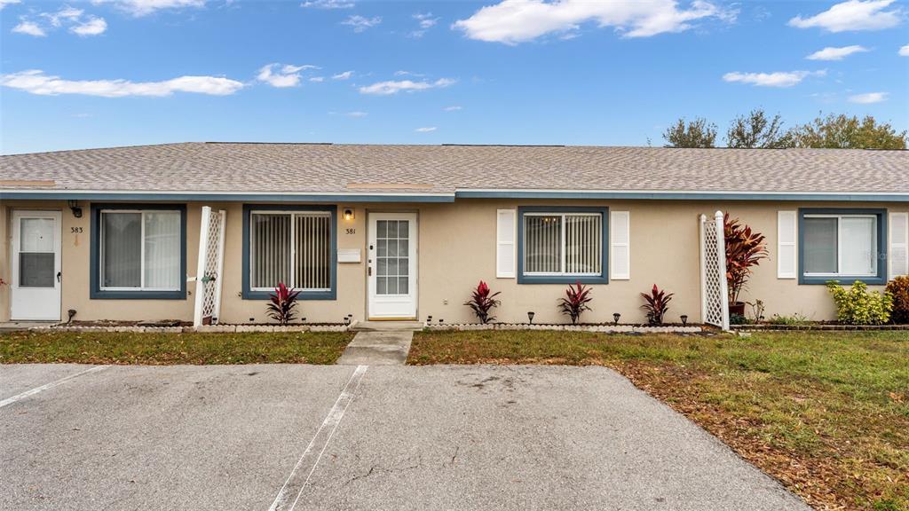 381 Winter Ridge Boulevard Winter Haven, FL 33881 - Photo 32 of 50 a front view of a house with a yard