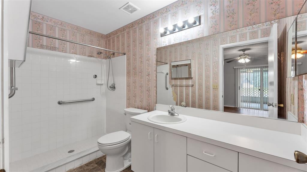 381 Winter Ridge Boulevard Winter Haven, FL 33881 - Photo 34 of 50 a bathroom with a sink toilet and shower