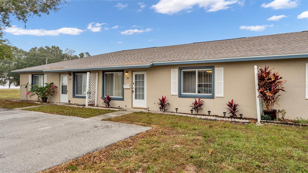 381 Winter Ridge Boulevard Winter Haven, FL 33881 - Photo 38 of 50 a front view of house with outdoor space and garden