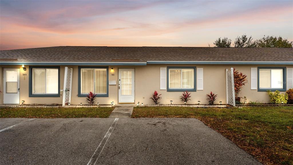 381 Winter Ridge Boulevard Winter Haven, FL 33881 - Photo 50 of 50 a front view of a house with a yard