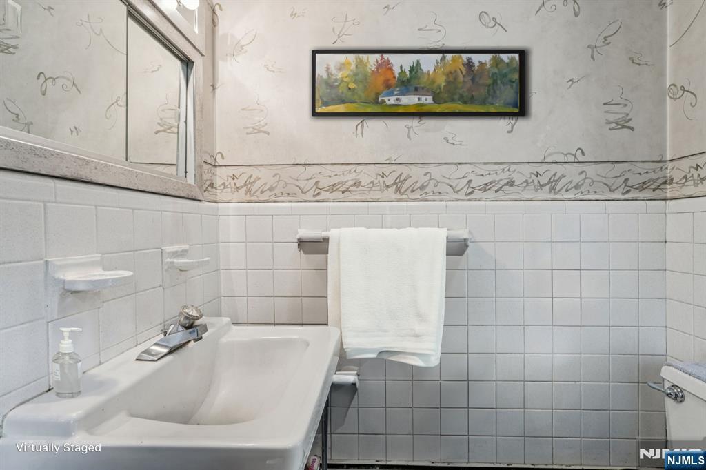 59 Old Stone Church Road Upper Saddle River, NJ 07458 - Photo 11 of 24 a bathroom with a sink and a mirror