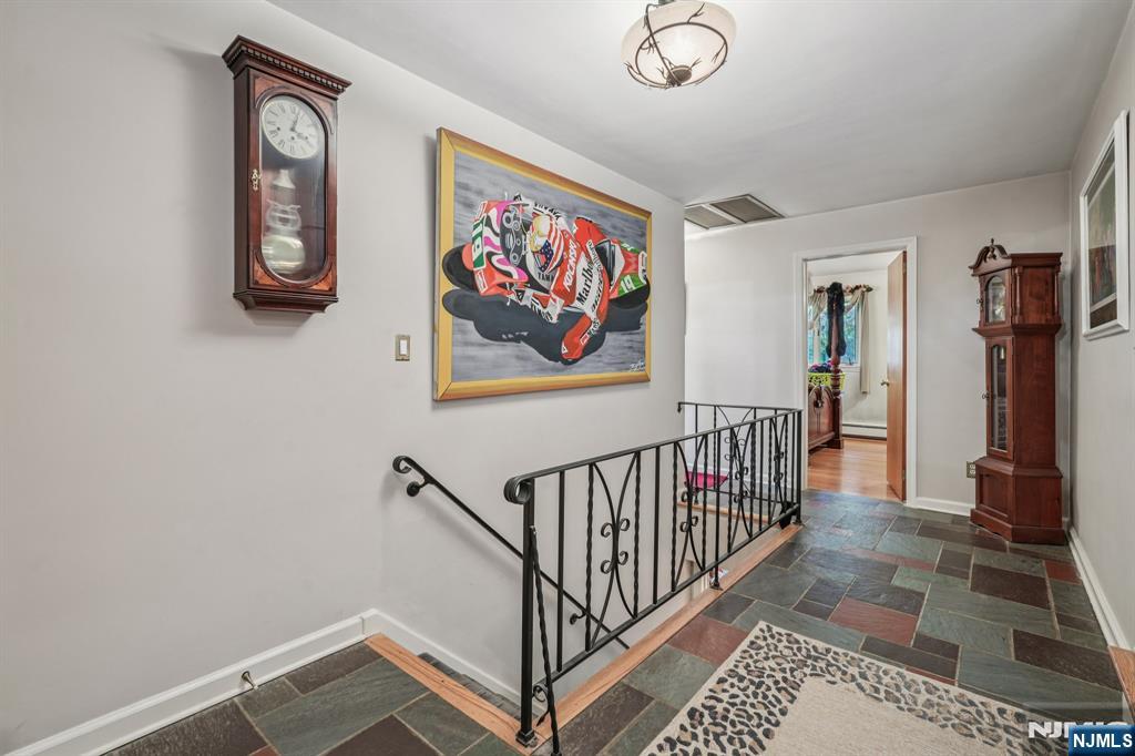 59 Old Stone Church Road Upper Saddle River, NJ 07458 - Photo 14 of 24 a view of entryway with stairs and wooden floor