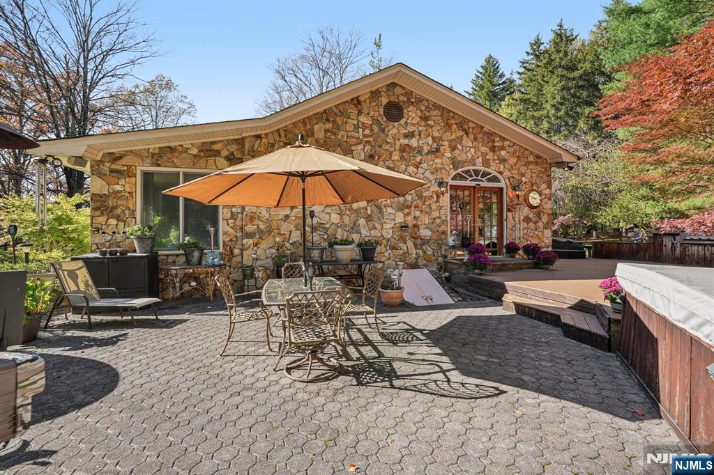 59 Old Stone Church Road Upper Saddle River, NJ 07458 - Photo 16 of 24 a view of a backyard with sitting area