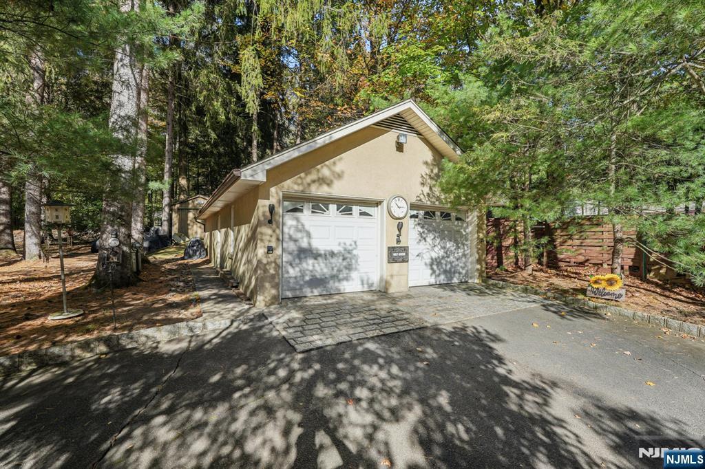 59 Old Stone Church Road Upper Saddle River, NJ 07458 - Photo 20 of 24 a view of a house with a yard