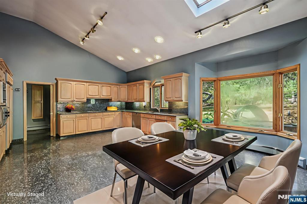 59 Old Stone Church Road Upper Saddle River, NJ 07458 - Photo 3 of 24 a living room with couches a dining table and chairs with kitchen view