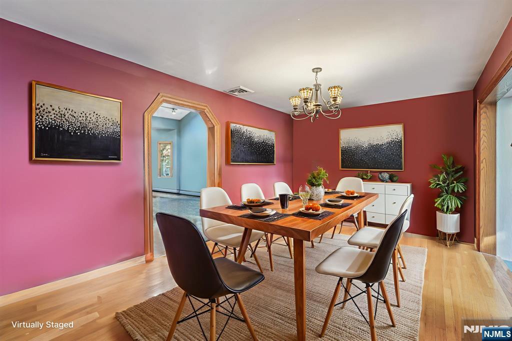 59 Old Stone Church Road Upper Saddle River, NJ 07458 - Photo 6 of 24 a view of a dining room with furniture and a chandelier